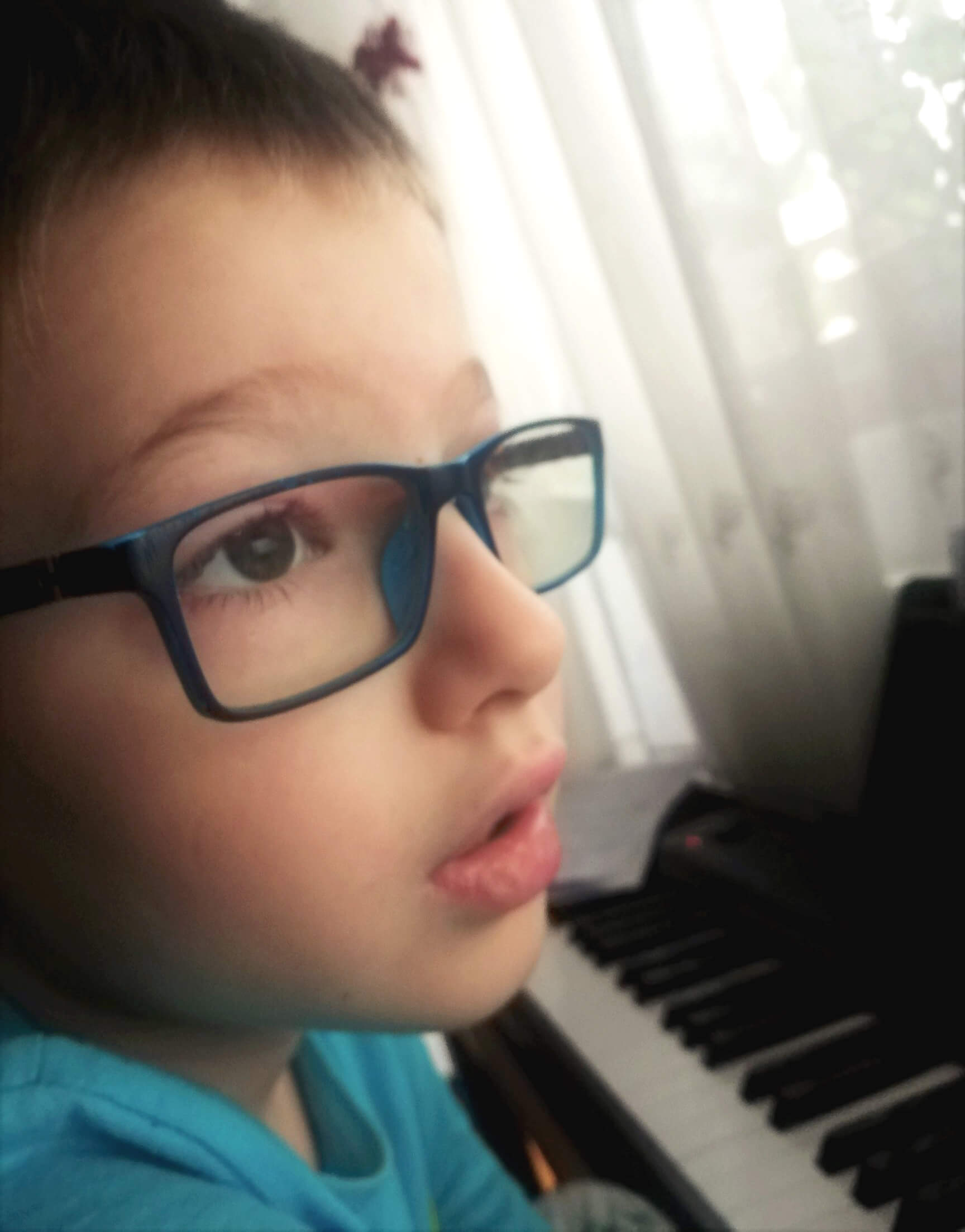 Young boy at piano